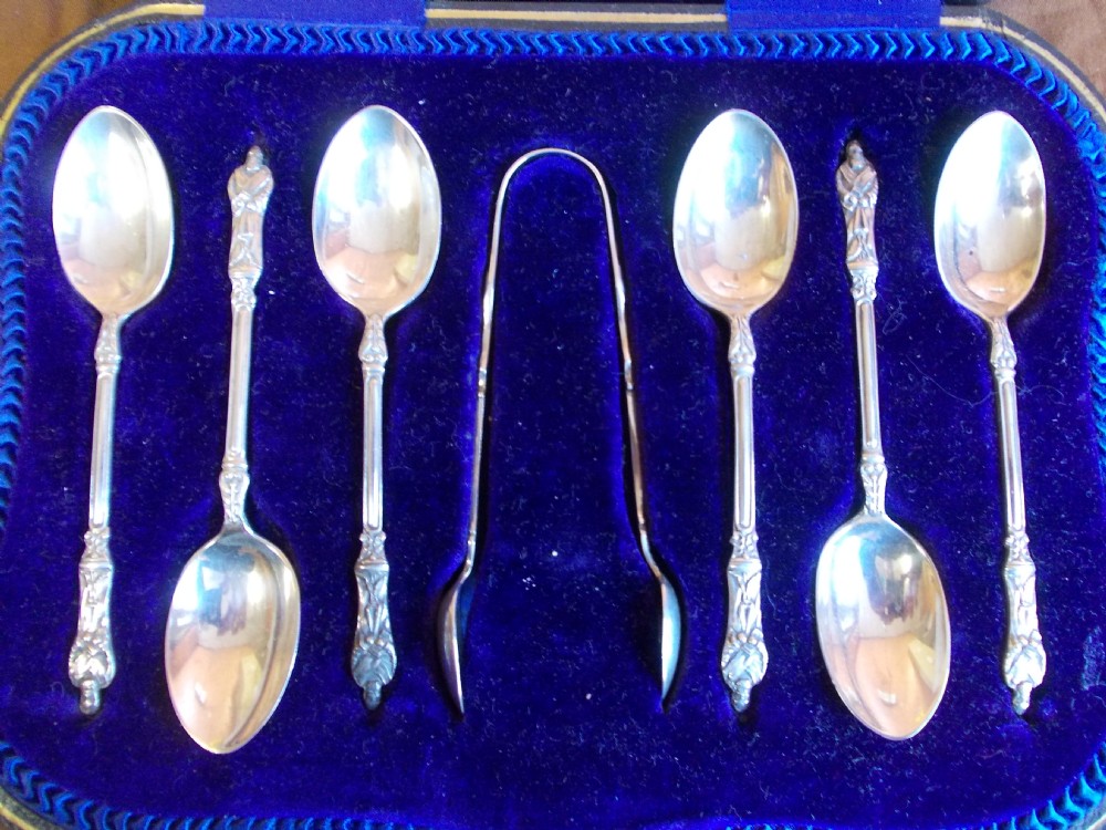silver apostle spoons and sugar tongs